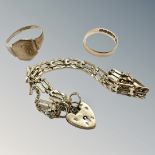 A 9ct gold padlock bracelet and two similar rings. CONDITION REPORT: Damages. 10.