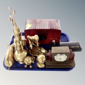 A tray of brass animal ornaments, crucifix, mantel clock,