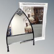 An arch topped mirror together with a further cream and grey bevelled mirror
