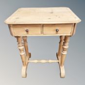 A 19th century pine side table fitted two drawers,