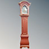 A Continental red and gilt longcase clock with pendulum - no weights