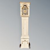 A continental cream and gilt longcase clock with brass and silvered dial,