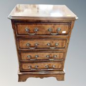 A reproduction mahogany four drawer low chest,