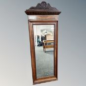 A 19th century walnut mirror,