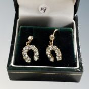 A pair of 9ct gold and white stone earrings in the shape of lucky horseshoes