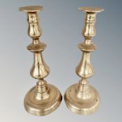 A pair of Victorian brass candlesticks,