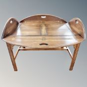 A mahogany butler's tray table