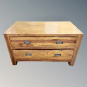 A contemporary hardwood two drawer low chest,