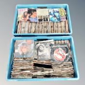 Two boxes of vinyl 45 singles : Simon & Garfunkel, Prince,