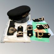 A tray of naval cap and epaulettes and ephemera relating to HMS Fiskgard