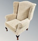 A Parker Knoll wingback armchair