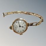 A lady's 9ct gold watch upon a bracelet stamped '9ct on Silver',