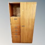 A mid century teak effect wardrobe