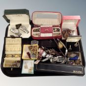 A tray of wristwatches, costume jewellery, silver ARP badge,