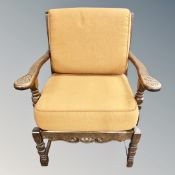 A continental carved beech armchair