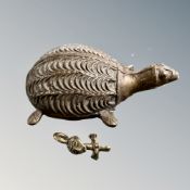 A West African brass weight in the form of a woman and a further turtle figure for weighing gold