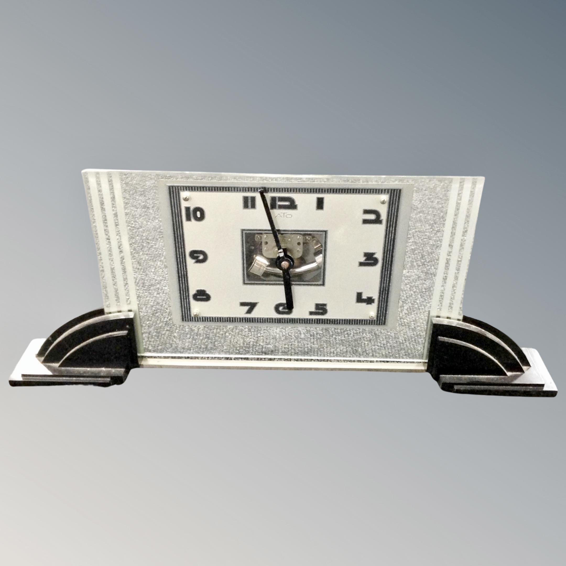 An Ato glass mantel timepiece,
