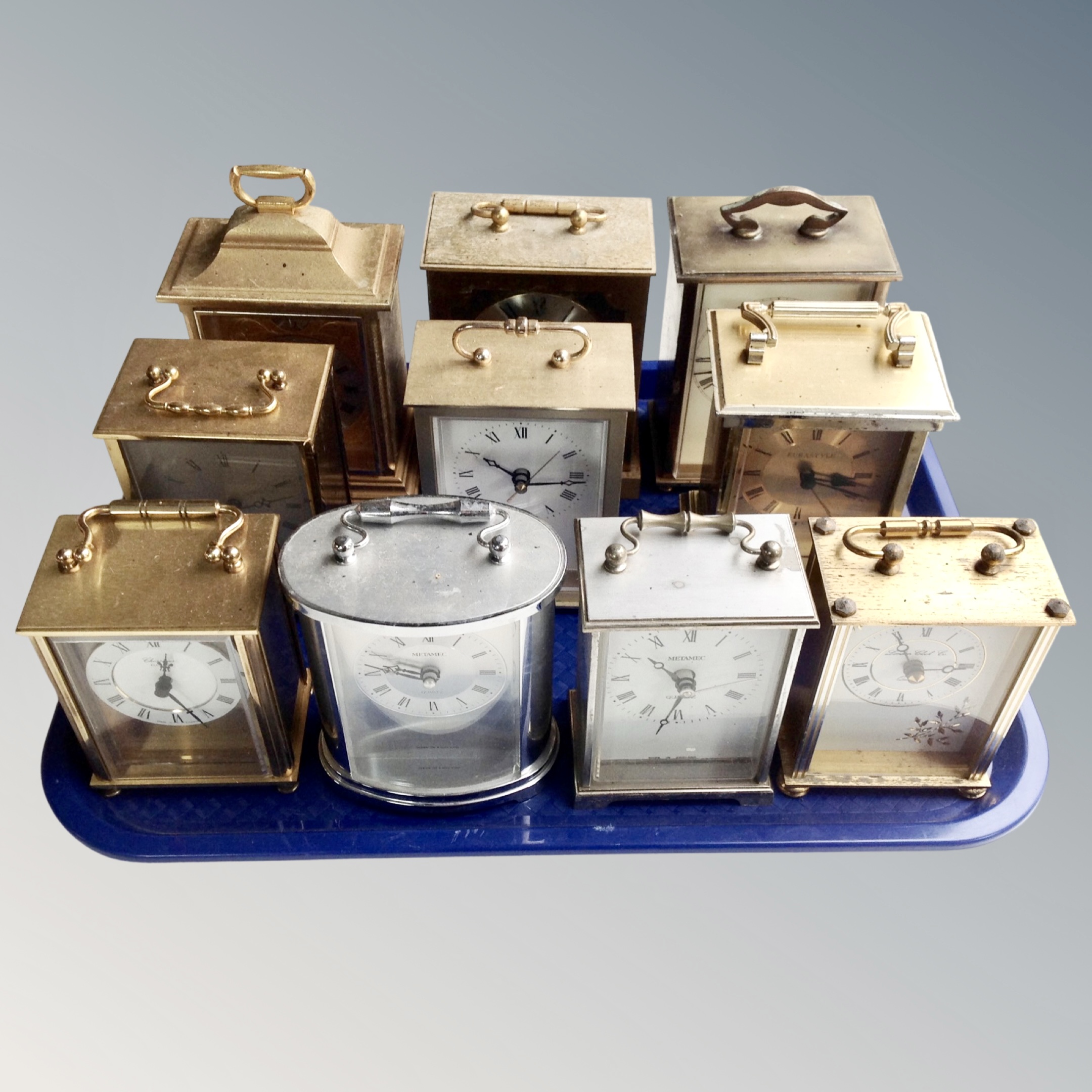 A tray of ten battery operated carriage clocks