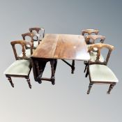 A mahogany drop leaf dining table together with a set of six chairs
