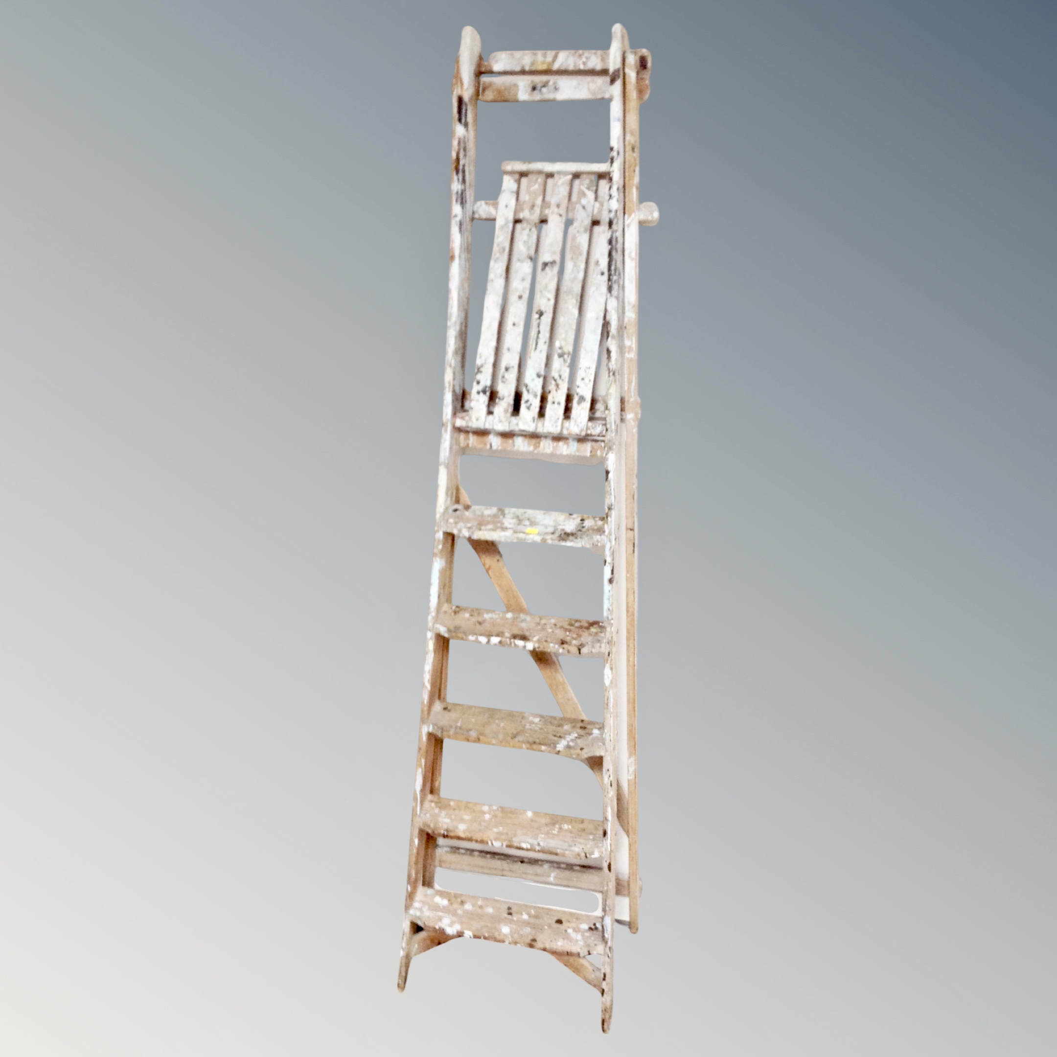 A set of folding wooden step ladders