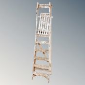 A set of folding wooden step ladders