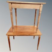 A teak rectangular occasional table and a further pine table