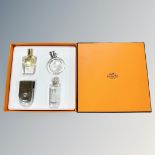 An Hermes Parfums four-piece deluxe replica set, in presentation Hermes orange card box.