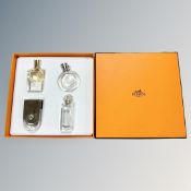 An Hermes Parfums four-piece deluxe replica set, in presentation Hermes orange card box.