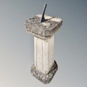 A stone column sundial, 34cm wide by 34cm deep by 96cm high.