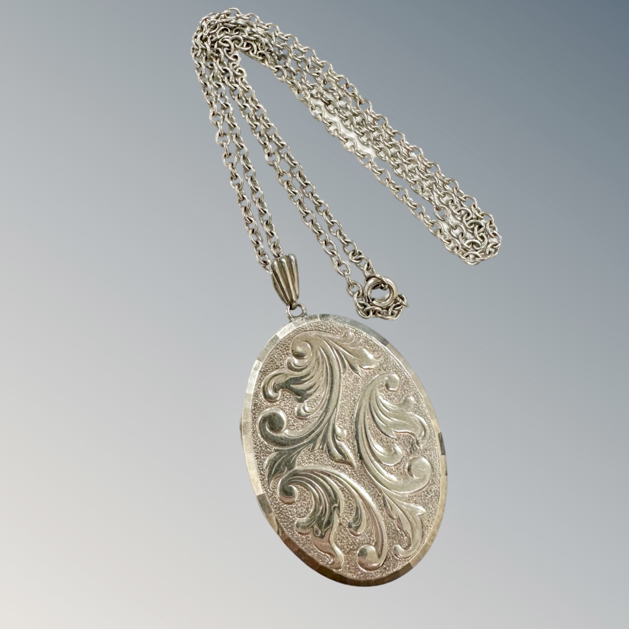 A large silver locket and chain