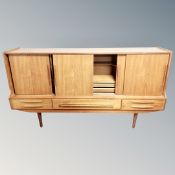 A 1970's teak sliding door sideboard,