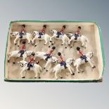 A group of painted metal cavalry figures