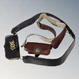 A black leather Corps of Commissionaire's belt and a Boy's Brigade brown leather belt