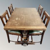 An oak pull out dining table and four chairs