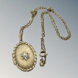 A 9ct gold locket on chain CONDITION REPORT: 9.