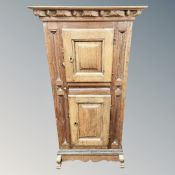 A 19th century Continental oak two door cabinet,