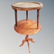 An Eastern engraved brass topped table together with circular pedestal table