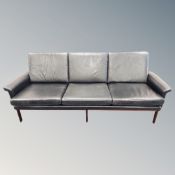 A late 20th century Scandinavian black leather three seater settee,