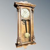 A Victorian eight day striking wall clock with pendulum