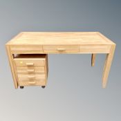 A contemporary pine office table fitted a drawer,