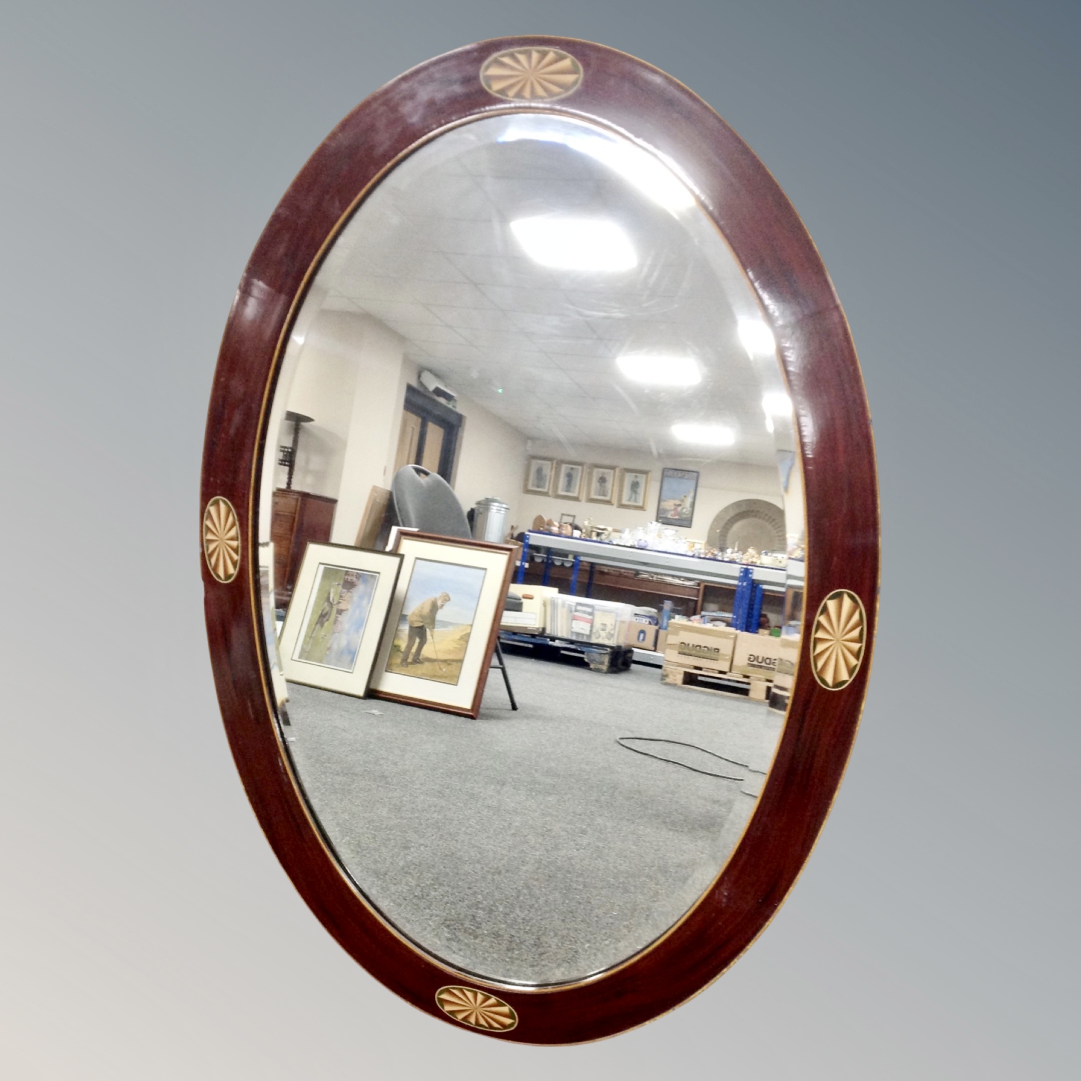 A Victorian style oval framed mirror