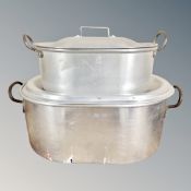 Four various aluminium and galvanized metal cooking pans.