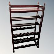 A wine rack in a mahogany finish