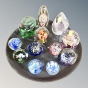 Twelve contemporary glass paperweight including Caithness,