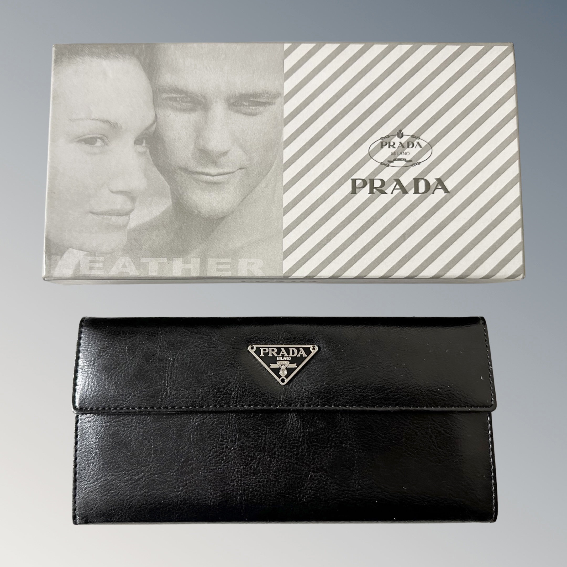 A Prada black leather wallet in original box