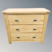 A contemporary oak three drawer chest