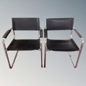 A pair of black leather and tubular metal armchairs,