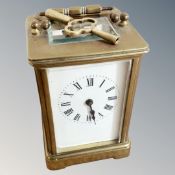 A brass cased carriage timepiece with key