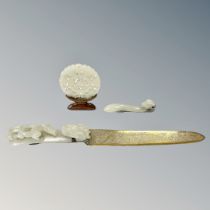 A Chinese carved jade disc on stand (diameter 55mm), together with two carved jade ruyi sceptres,