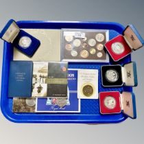 A tray of British decimal coins sets, cased crowns,